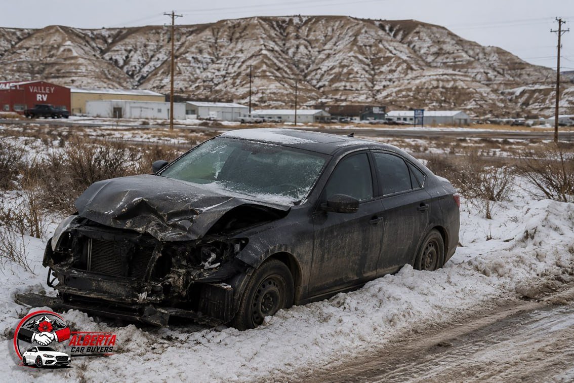 A wrecked car in snow